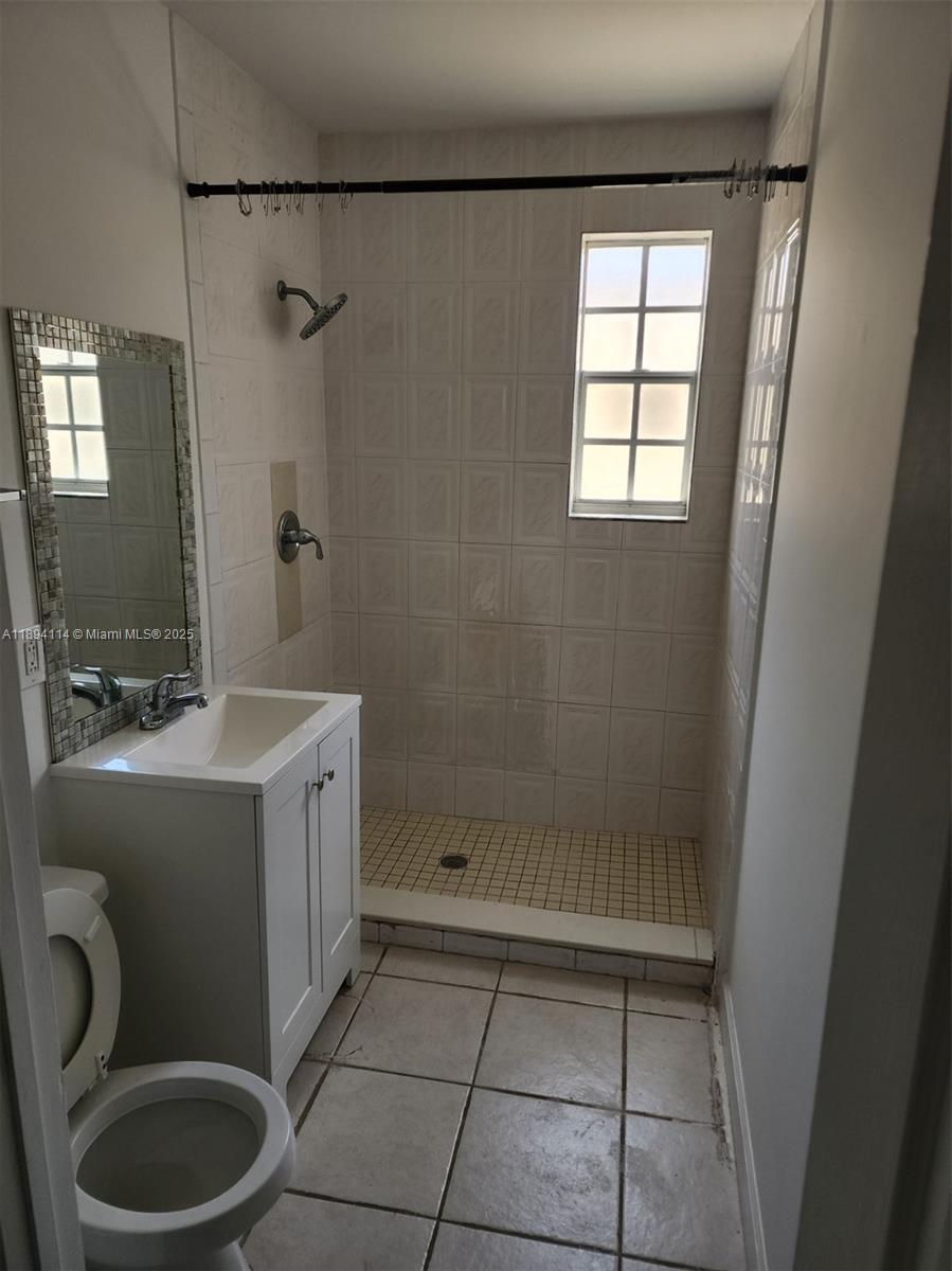 14240 Northwest 22nd Avenue, Unit 3 Opa-Locka, FL 33054 - Photo 35 of 49 a bathroom with a sink toilet and shower