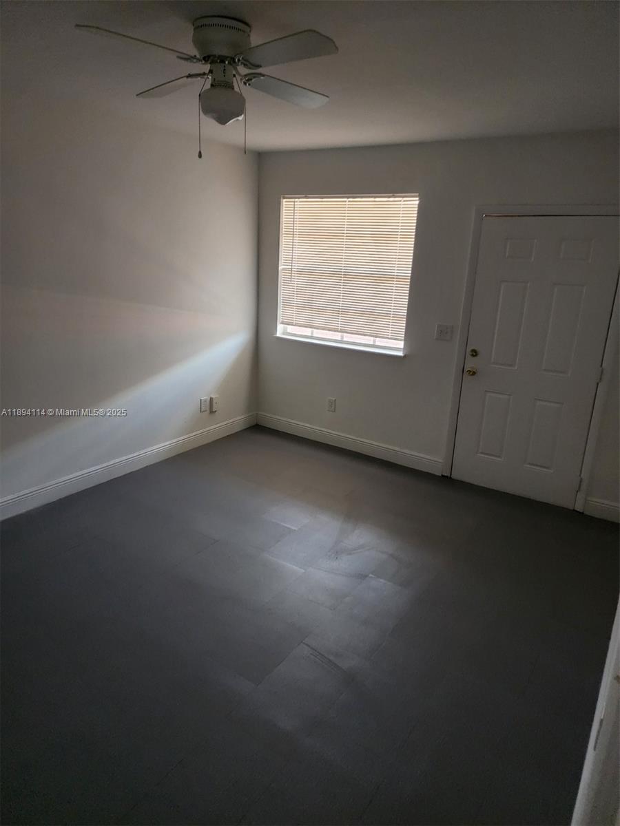 14240 Northwest 22nd Avenue, Unit 3 Opa-Locka, FL 33054 - Photo 39 of 49 an empty room with a window
