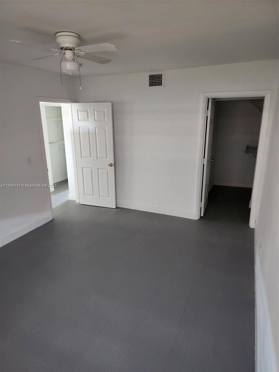 14240 Northwest 22nd Avenue, Unit 3 Opa-Locka, FL 33054 - Photo 40 of 49 an empty room with a window