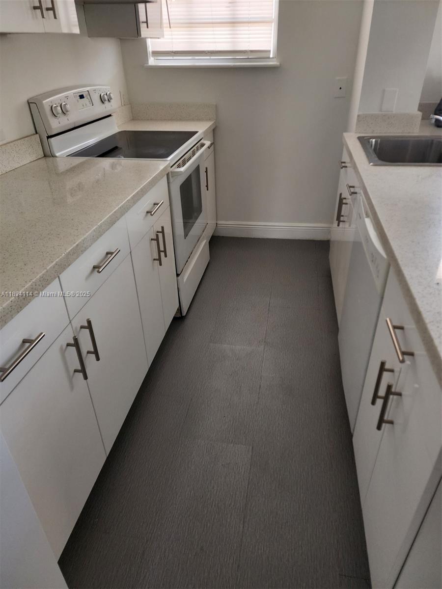 14240 Northwest 22nd Avenue, Unit 3 Opa-Locka, FL 33054 - Photo 46 of 49 a utility room with dryer and washer