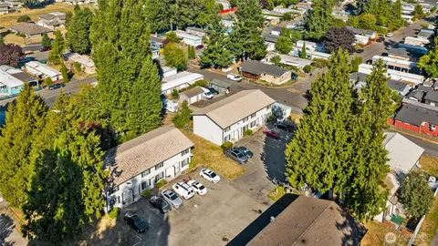 an aerial view of a house with a yard