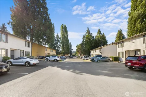 a view of a cars parked in front of a house