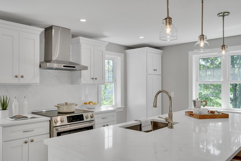 956 Waltham Street Lexington, MA 02421 - Photo 1 of 41 a kitchen with stainless steel appliances granite countertop a stove a sink a refrigerator and a wooden floors