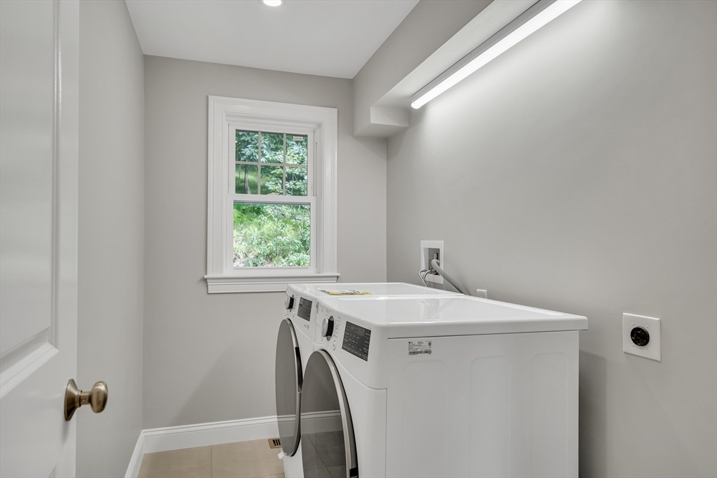 956 Waltham Street Lexington, MA 02421 - Photo 16 of 41 a utility room with a window dryer and washer