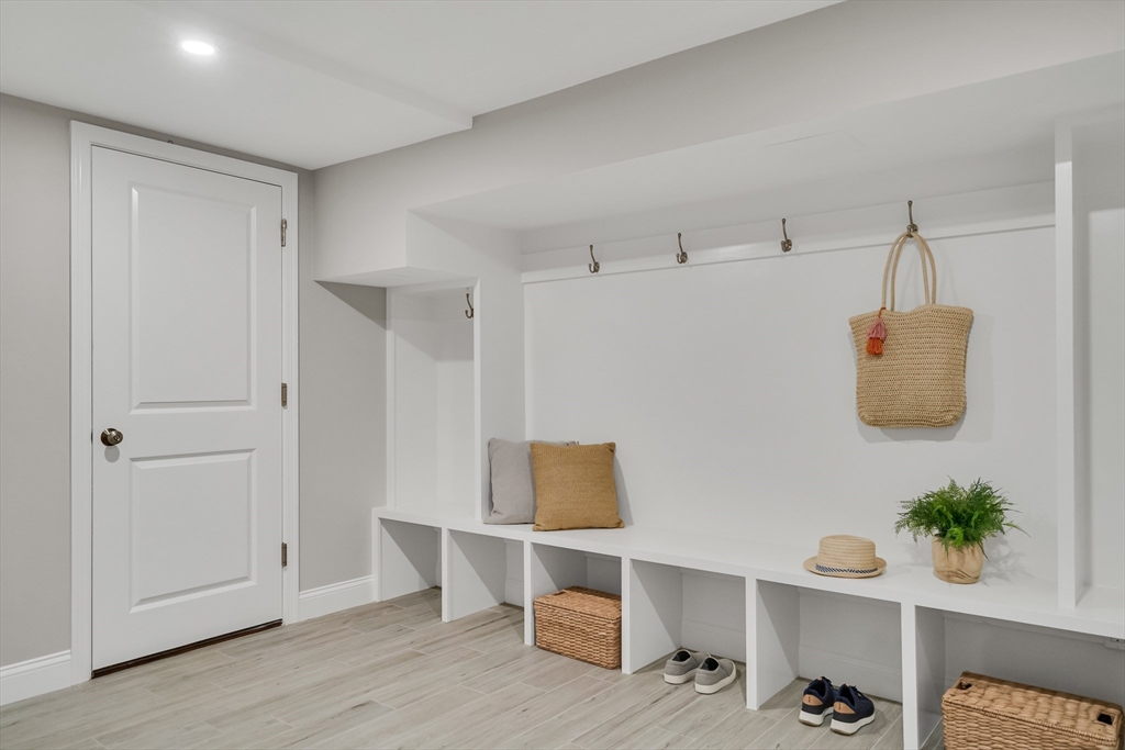 956 Waltham Street Lexington, MA 02421 - Photo 20 of 41 a living room with furniture and a potted plant