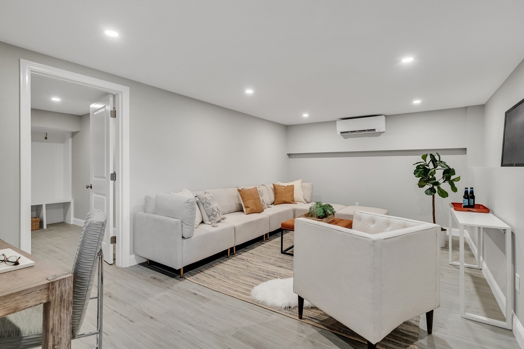 956 Waltham Street Lexington, MA 02421 - Photo 21 of 41 a living room with furniture and a potted plant