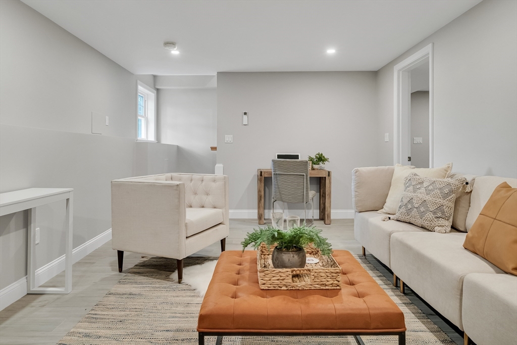 956 Waltham Street Lexington, MA 02421 - Photo 22 of 41 a living room with furniture and wooden floor