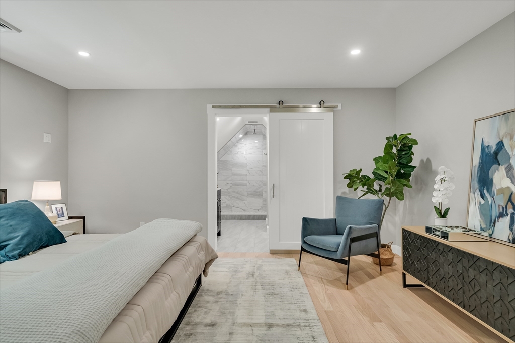 956 Waltham Street Lexington, MA 02421 - Photo 25 of 41 a living room with furniture and a potted plant