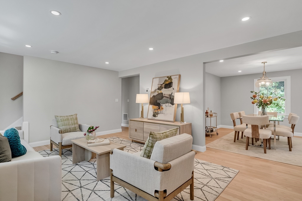 956 Waltham Street Lexington, MA 02421 - Photo 3 of 41 a living room with furniture and a dining table with rug