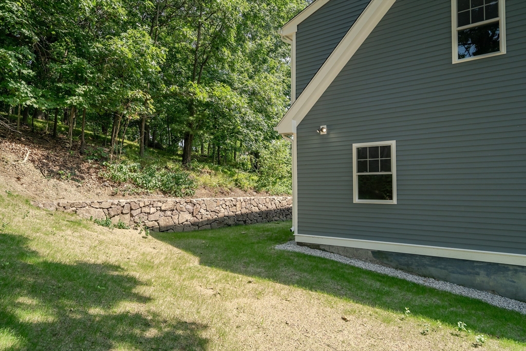 956 Waltham Street Lexington, MA 02421 - Photo 37 of 41 a side view of a house with a yard