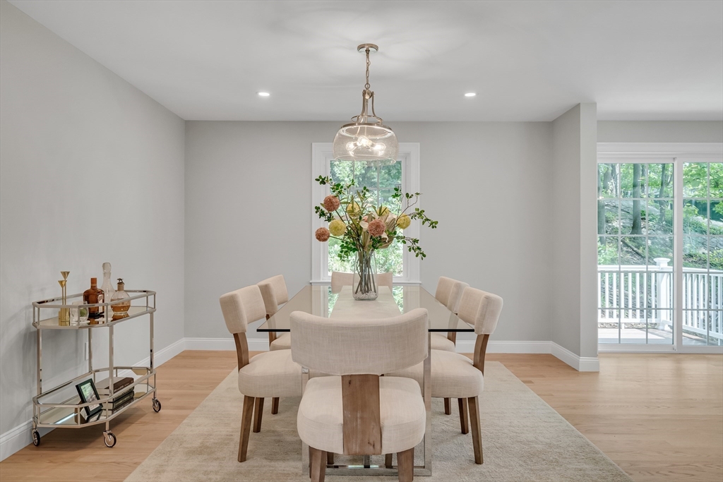 956 Waltham Street Lexington, MA 02421 - Photo 7 of 41 a dining room with furniture potted plants and wooden floor