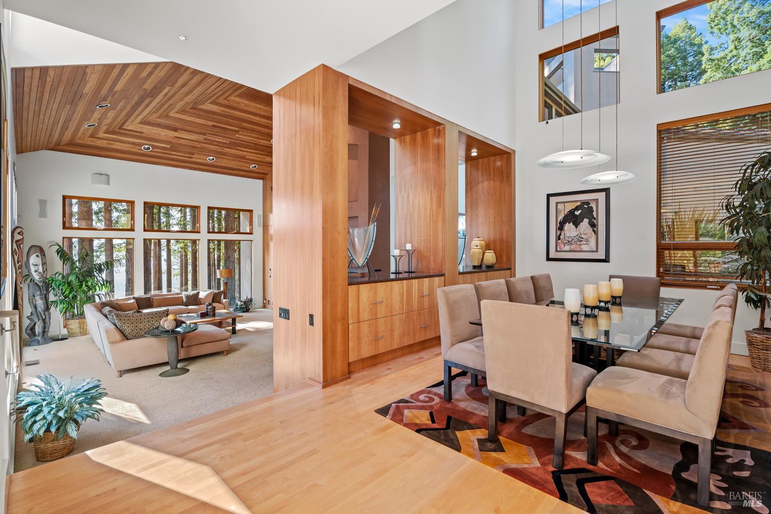 700 Holmes Ranch Road Philo, CA 95466 - Photo 16 of 42 a living room with furniture a large window and potted plants