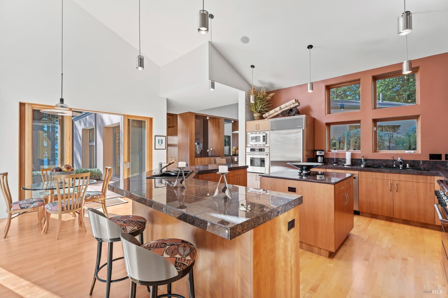 700 Holmes Ranch Road Philo, CA 95466 - Photo 19 of 42 an open kitchen with granite countertop a stove and white cabinets