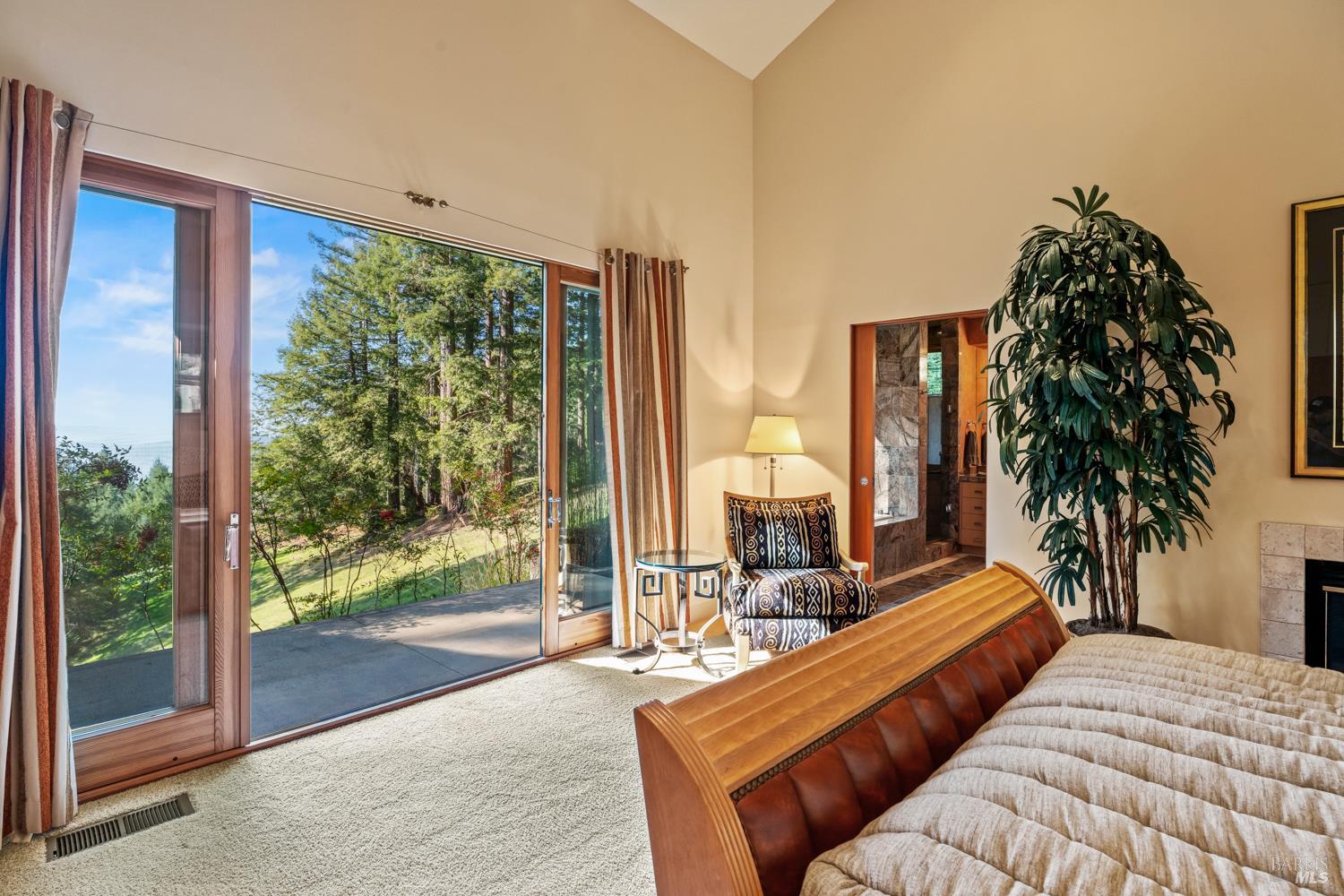 700 Holmes Ranch Road Philo, CA 95466 - Photo 30 of 42 a bedroom with furniture and large windows