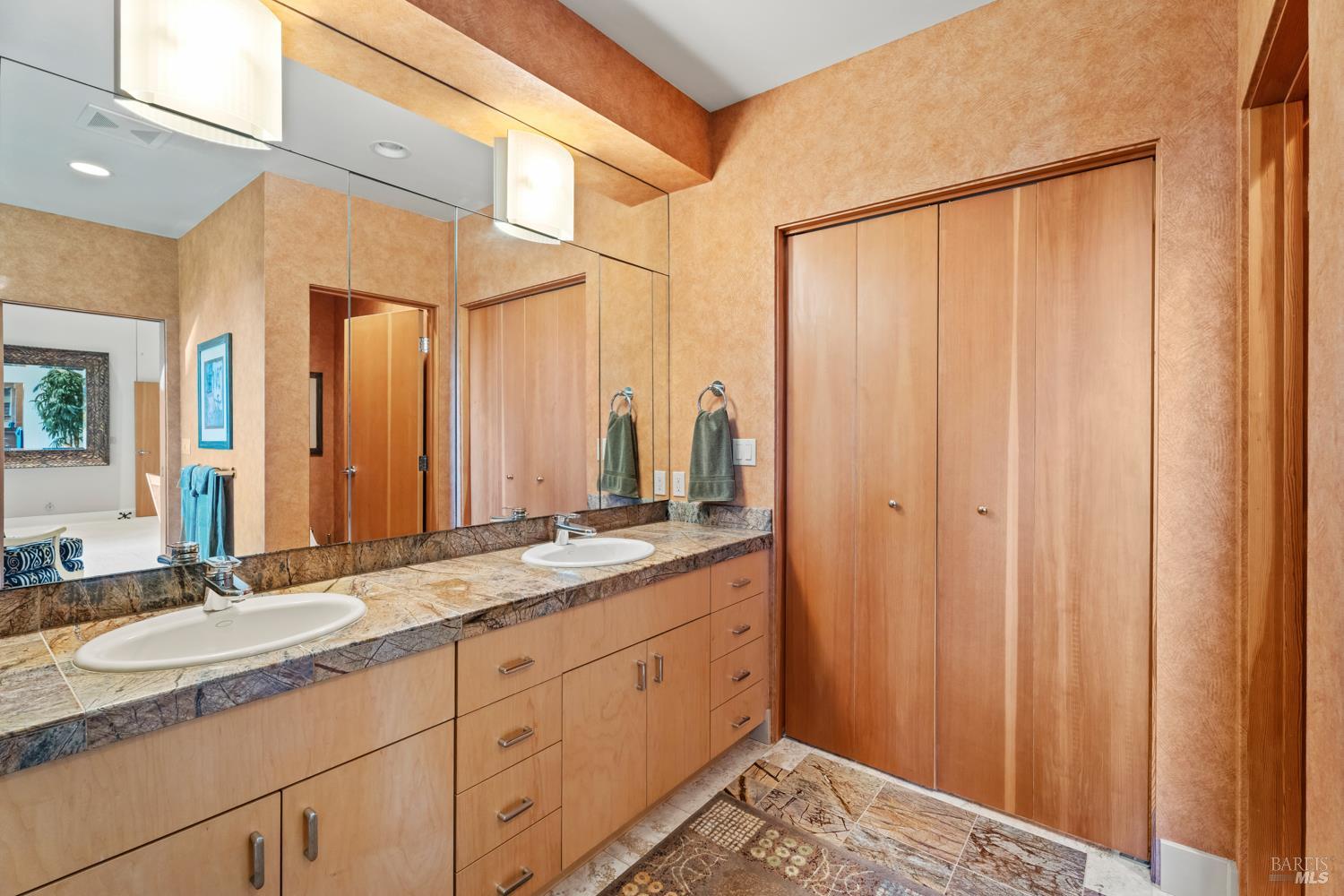700 Holmes Ranch Road Philo, CA 95466 - Photo 34 of 42 a bathroom with a granite countertop sink and a mirror