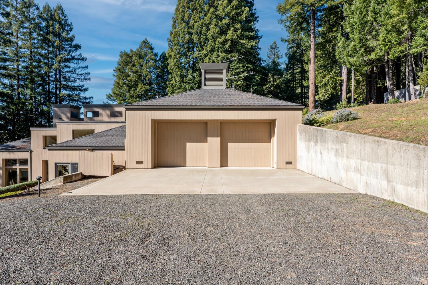 700 Holmes Ranch Road Philo, CA 95466 - Photo 35 of 42 a front view of a house with a yard and garage