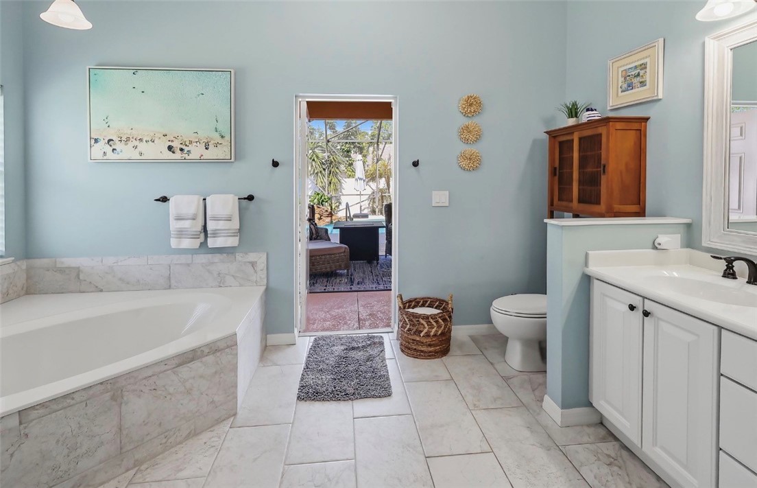 1771 Mistletoe Street Sebastian, FL 32958 - Photo 18 of 36 a spacious bathroom with a bathtub sink and toilet
