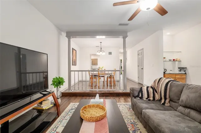 a bedroom with a bed and a ceiling fan