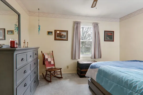 a bedroom with a bed and a couch
