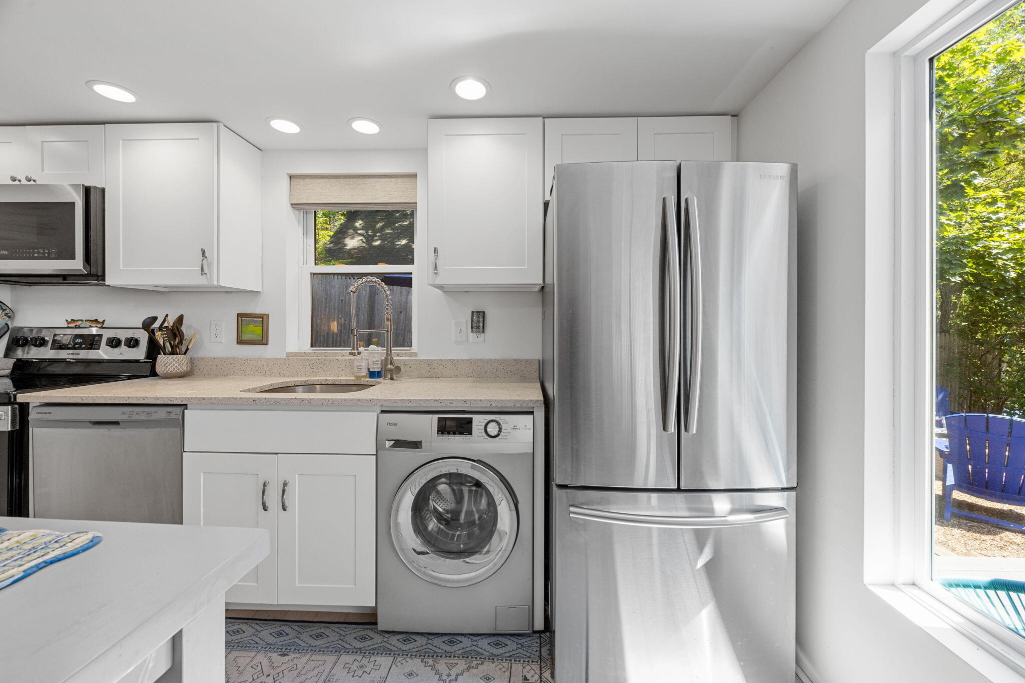 210 Chequessett Neck Road, Unit C Wellfleet, MA 02667 - Photo 12 of 37 a kitchen with a refrigerator sink and cabinets