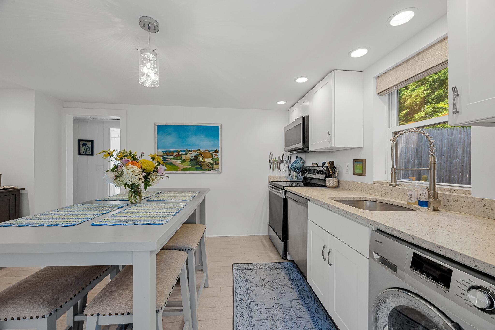 210 Chequessett Neck Road, Unit C Wellfleet, MA 02667 - Photo 13 of 37 a kitchen with stainless steel appliances granite countertop a sink stove and refrigerator