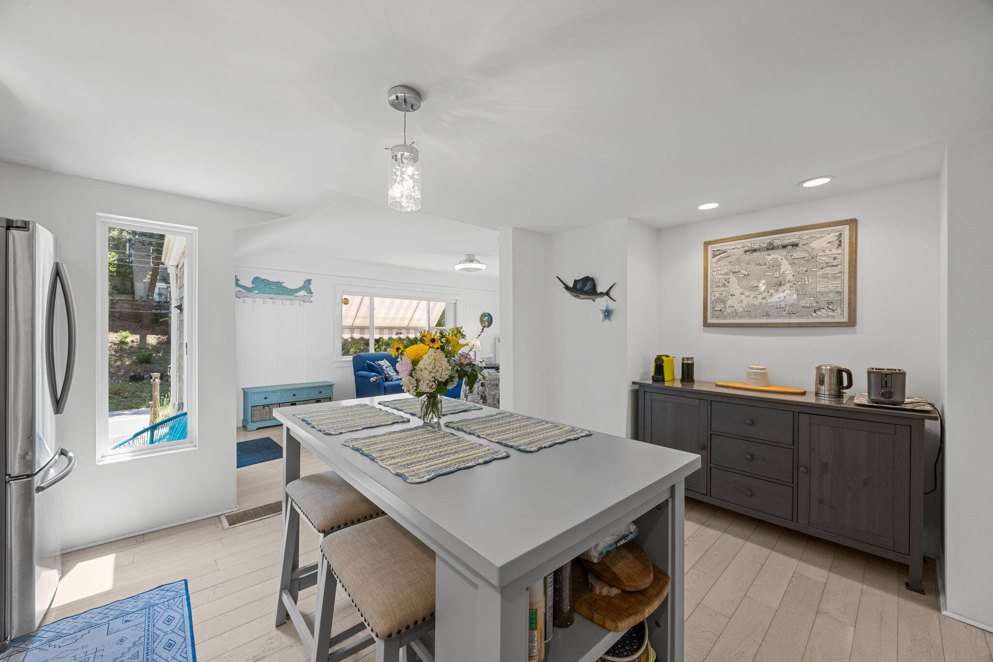 210 Chequessett Neck Road, Unit C Wellfleet, MA 02667 - Photo 15 of 37 a view of a dining room with furniture window and wooden floor