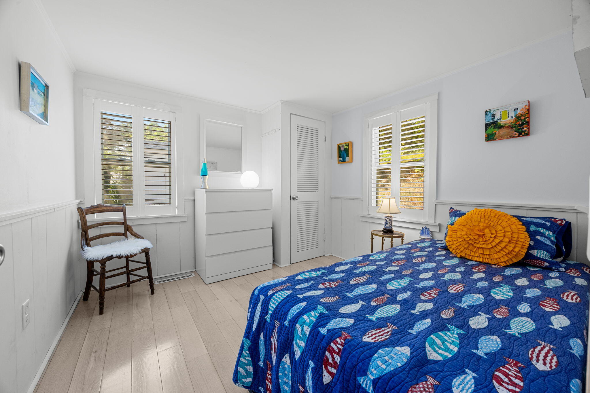 210 Chequessett Neck Road, Unit C Wellfleet, MA 02667 - Photo 20 of 37 a bedroom with a bed and wooden floor