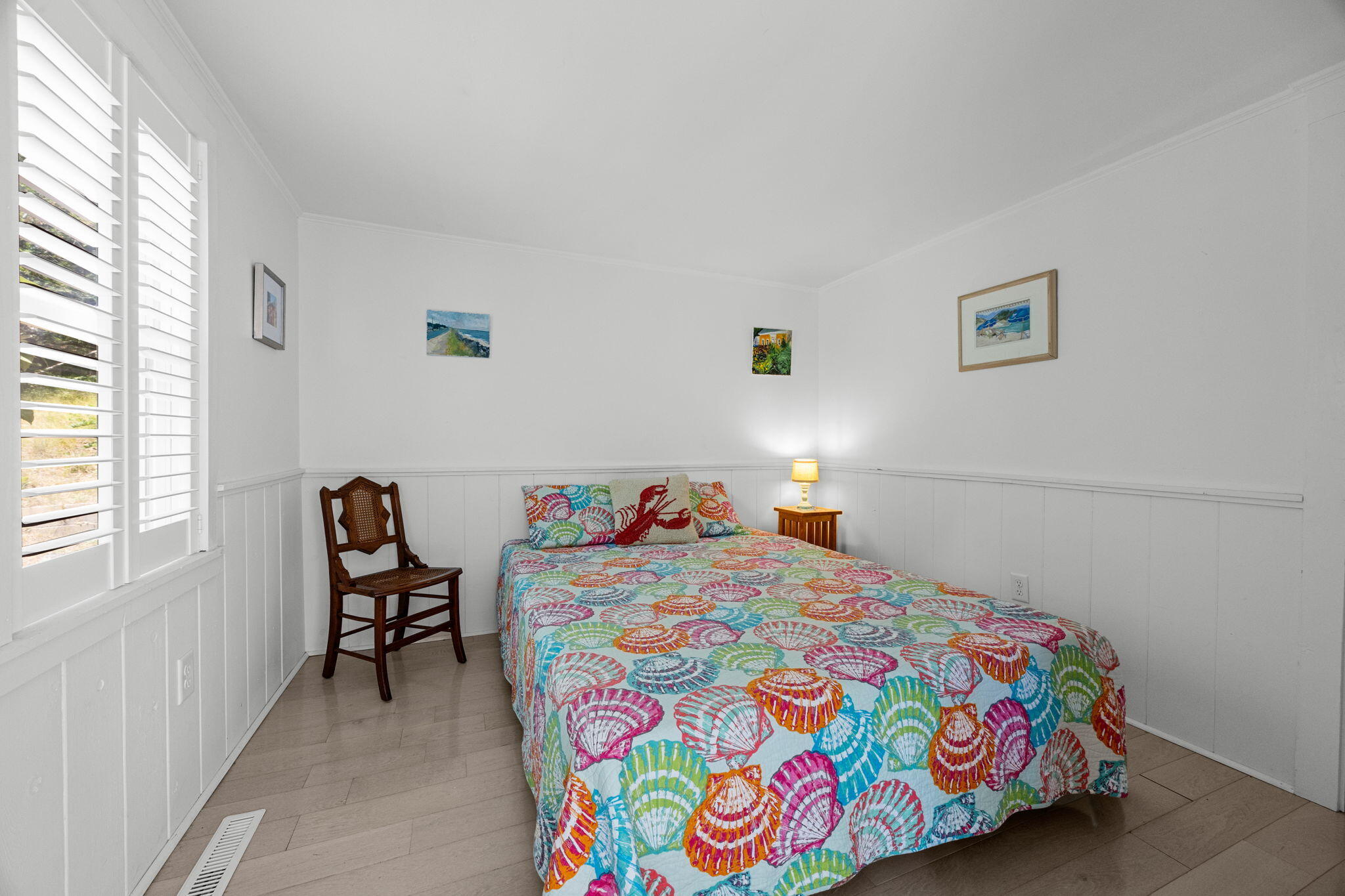 210 Chequessett Neck Road, Unit C Wellfleet, MA 02667 - Photo 22 of 37 a bedroom with a bed and a table