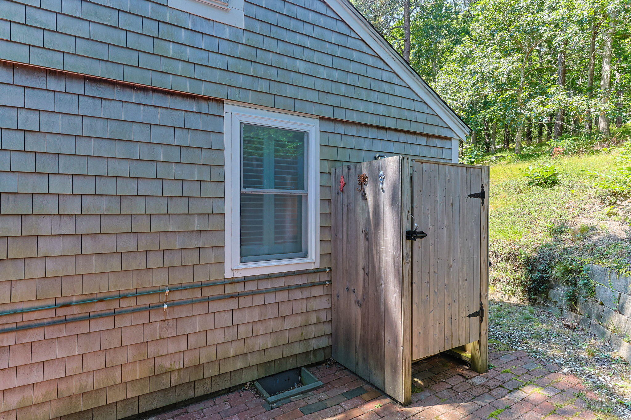 210 Chequessett Neck Road, Unit C Wellfleet, MA 02667 - Photo 24 of 37 a view of a small house with backyard