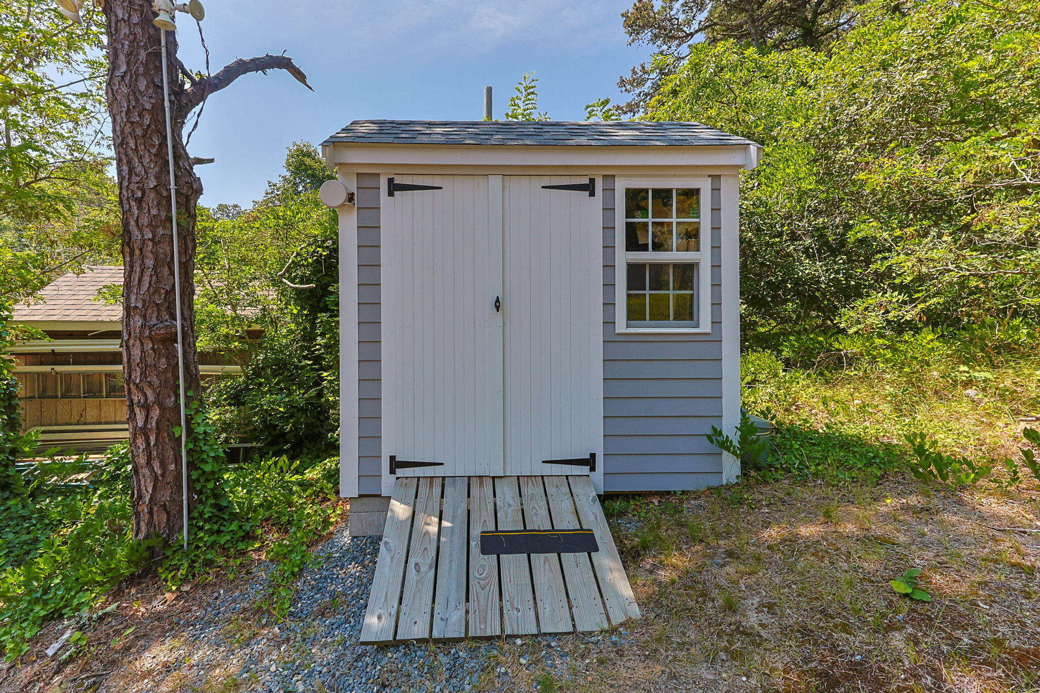 210 Chequessett Neck Road, Unit C Wellfleet, MA 02667 - Photo 30 of 37 a view of a house with a yard