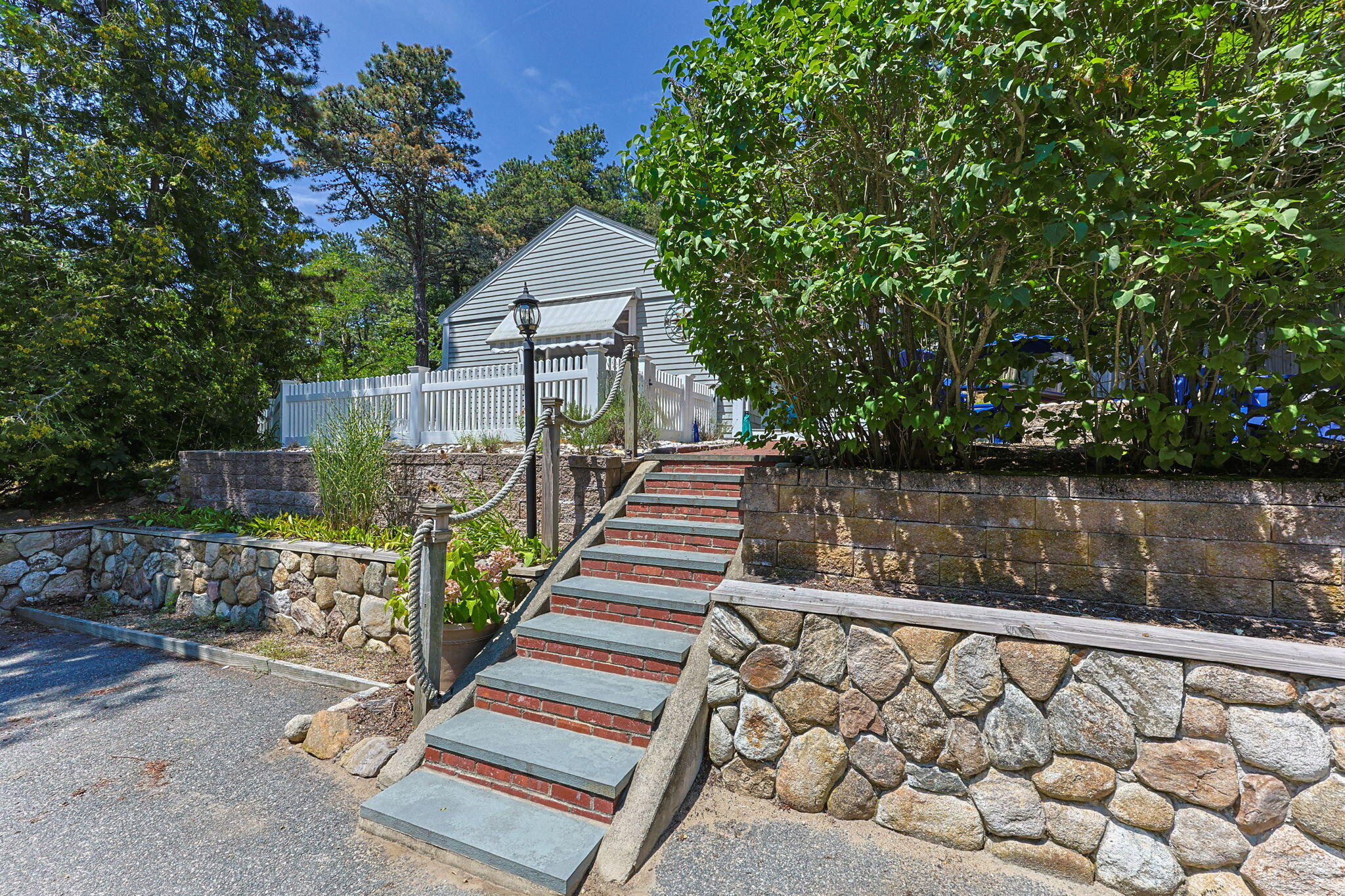 210 Chequessett Neck Road, Unit C Wellfleet, MA 02667 - Photo 3 of 37 a view of a house with wooden fence