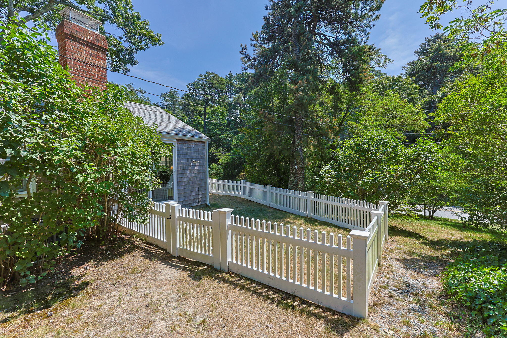 210 Chequessett Neck Road, Unit C Wellfleet, MA 02667 - Photo 32 of 37 a view of deck with green trees