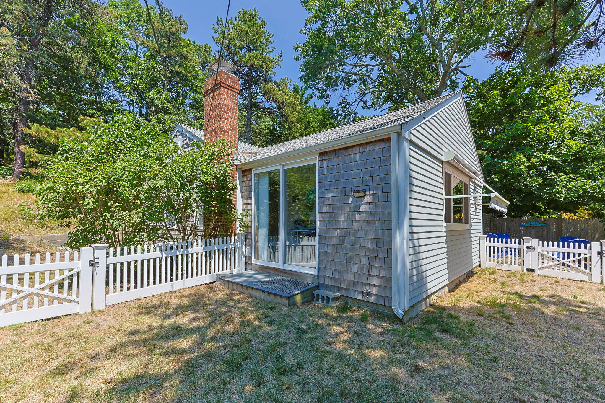 210 Chequessett Neck Road, Unit C Wellfleet, MA 02667 - Photo 33 of 37 a view of a house with a yard and fence