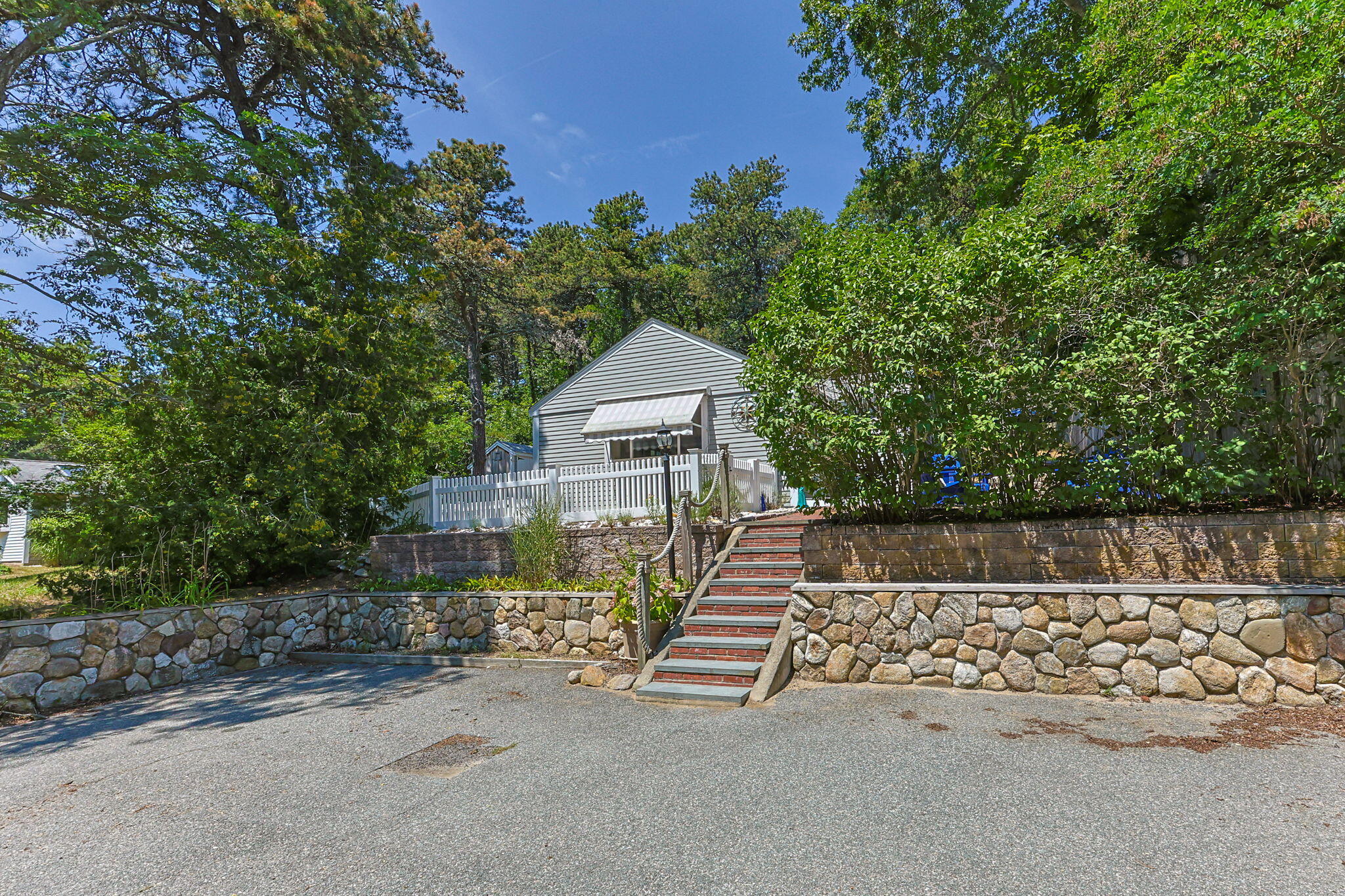 210 Chequessett Neck Road, Unit C Wellfleet, MA 02667 - Photo 37 of 37 a front view of a house with a yard