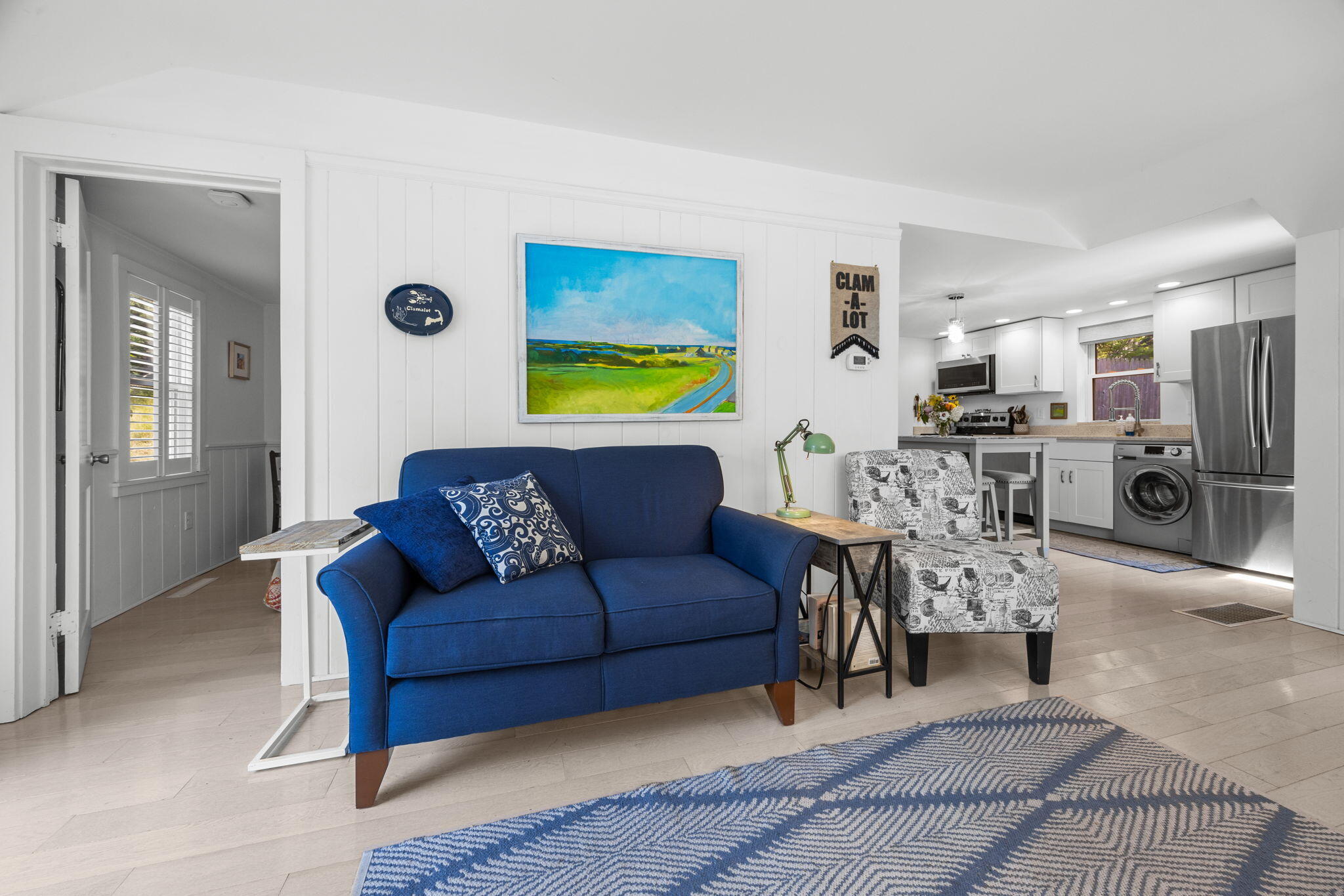210 Chequessett Neck Road, Unit C Wellfleet, MA 02667 - Photo 9 of 37 a living room with stainless steel appliances kitchen island granite countertop furniture and a rug