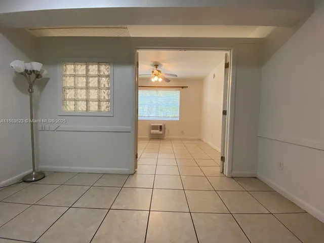 a view of an empty room and window