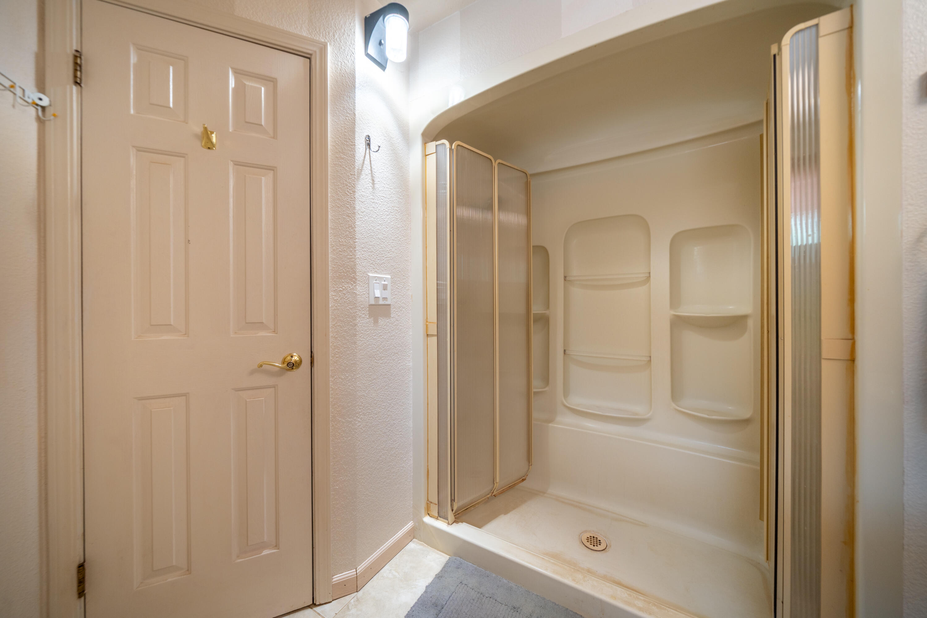 29061 South Cow Creek Road Whitmore, CA 96096 - Photo 15 of 27 a bathroom with a glass shower door