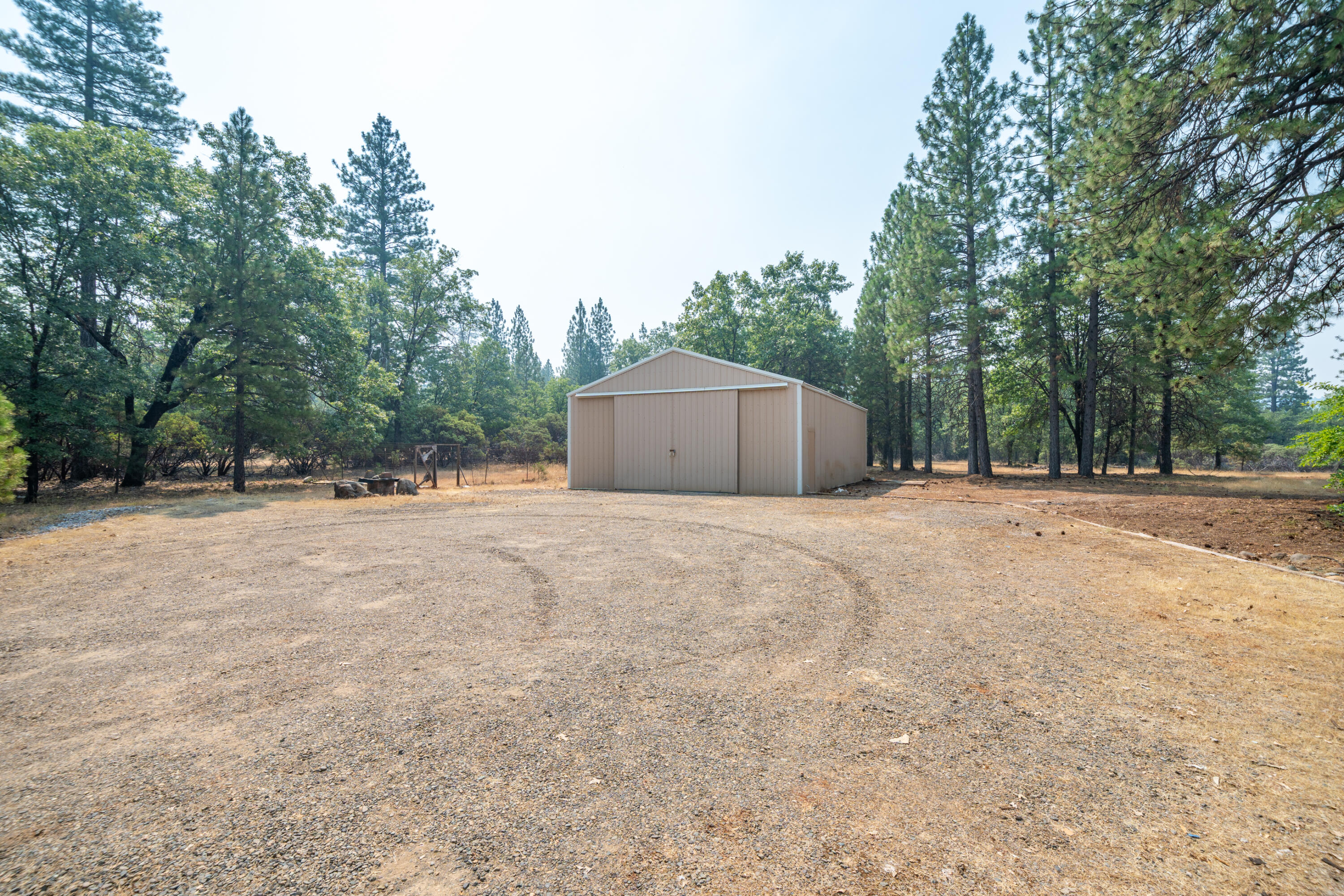 29061 South Cow Creek Road Whitmore, CA 96096 - Photo 22 of 27 a house with trees in front of it