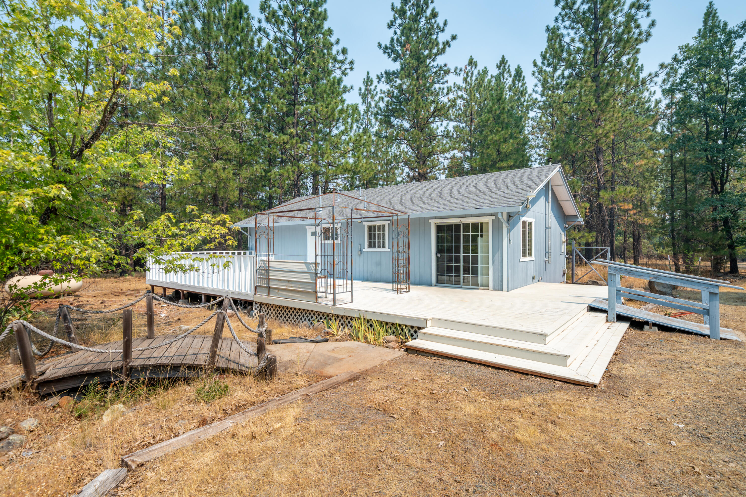 29061 South Cow Creek Road Whitmore, CA 96096 - Photo 26 of 27 a view of house with backyard and seating area