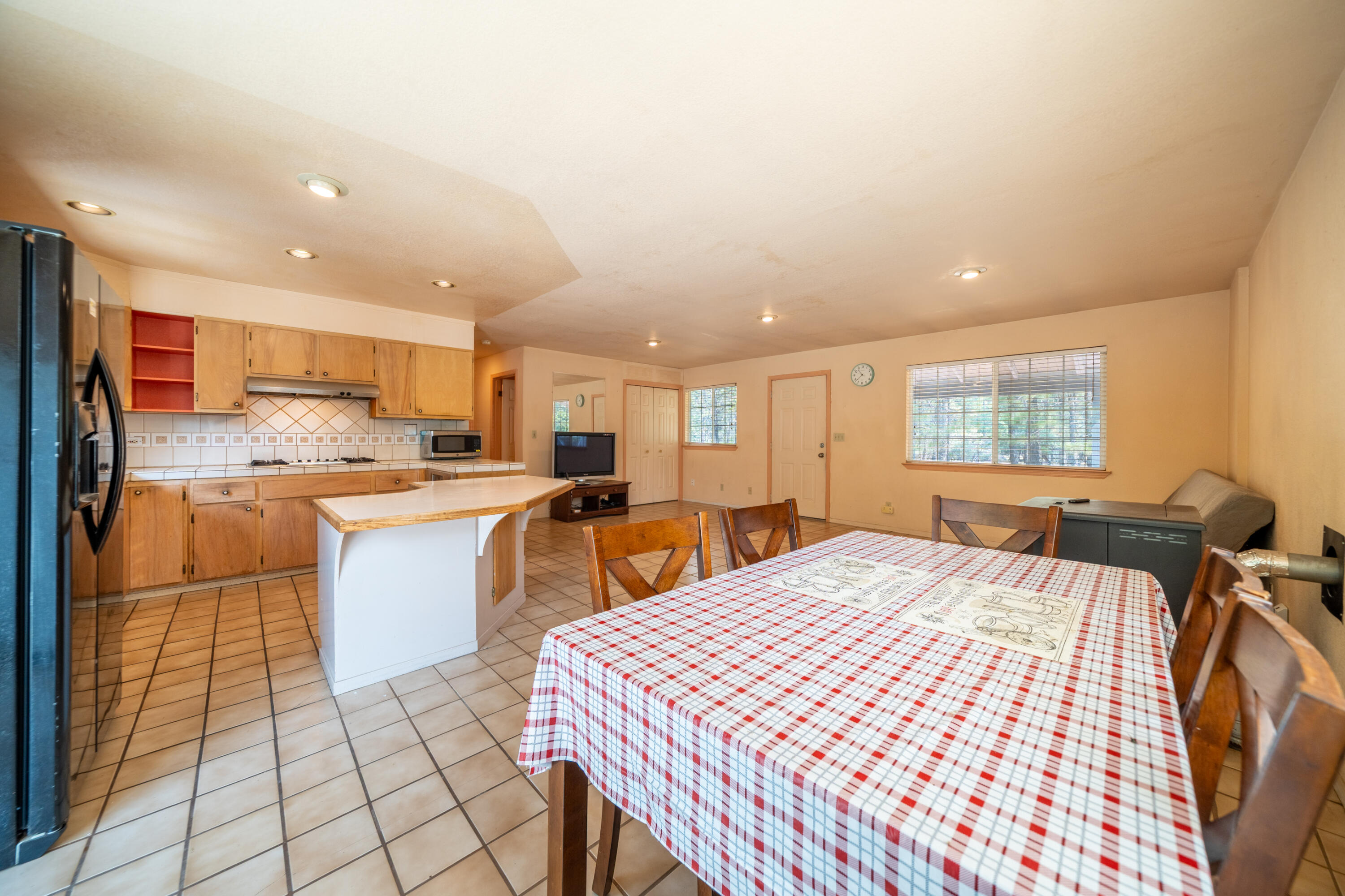 29061 South Cow Creek Road Whitmore, CA 96096 - Photo 6 of 27 a kitchen with stainless steel appliances kitchen island granite countertop a sink and cabinets