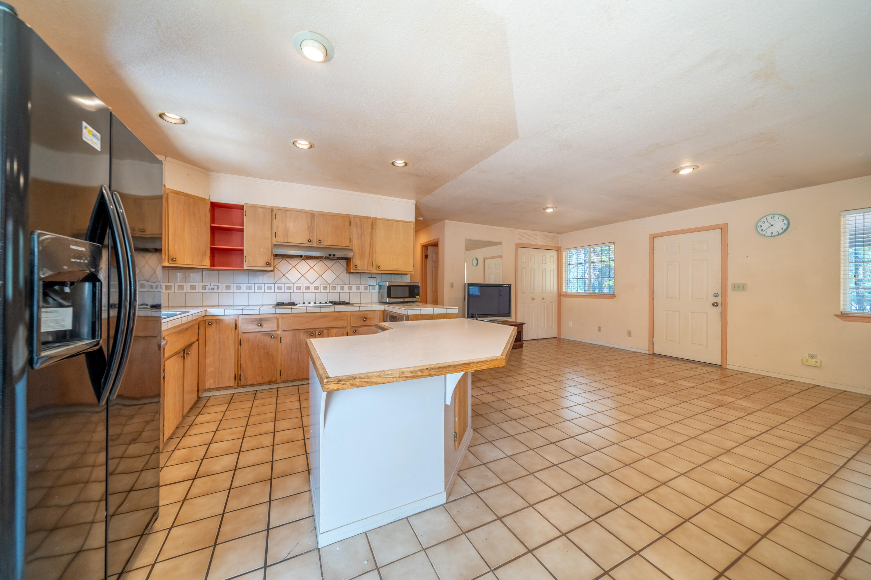 29061 South Cow Creek Road Whitmore, CA 96096 - Photo 7 of 27 a kitchen with stainless steel appliances granite countertop a sink and cabinets
