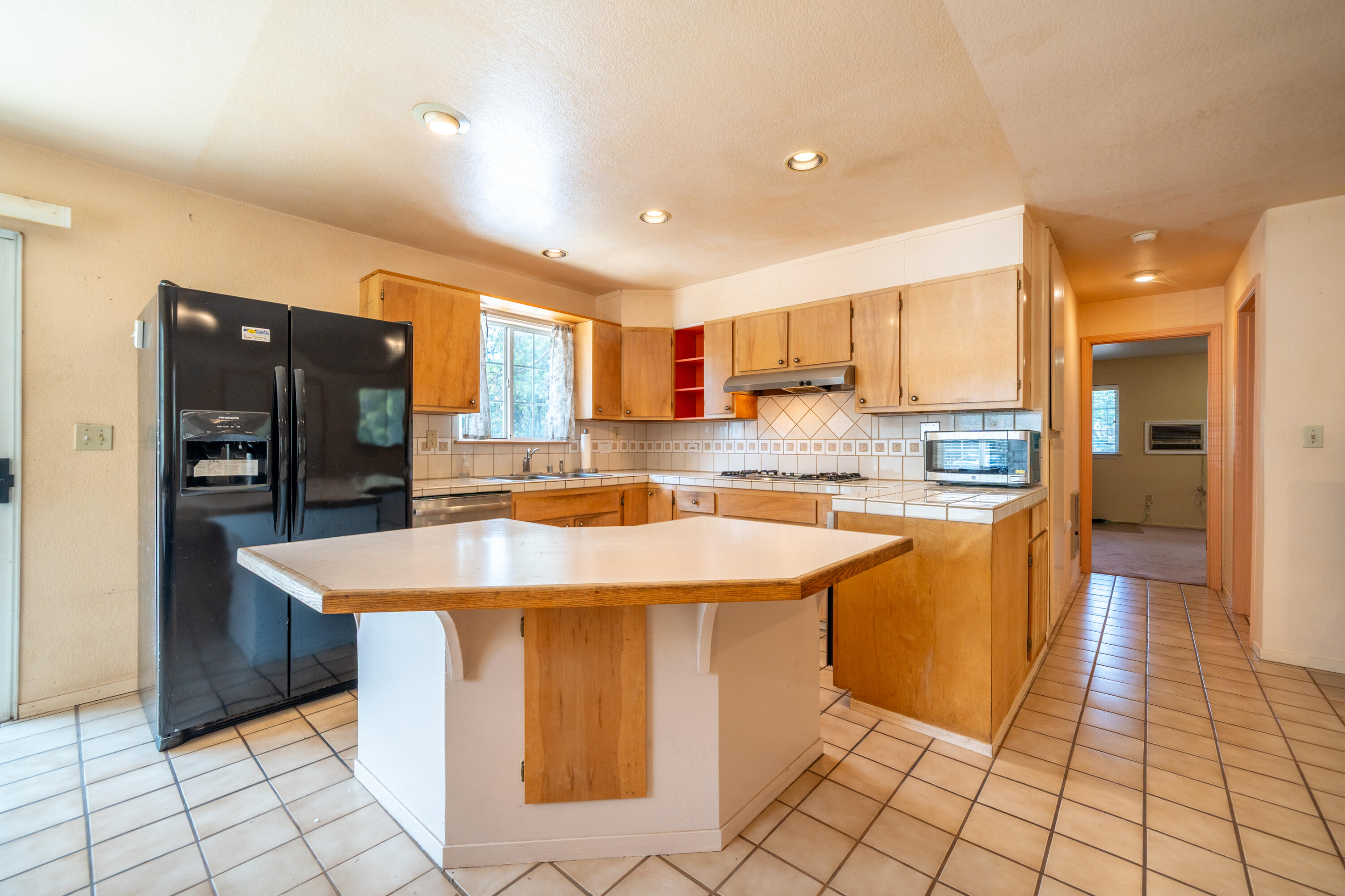 29061 South Cow Creek Road Whitmore, CA 96096 - Photo 8 of 27 a kitchen with stainless steel appliances granite countertop a sink and a refrigerator