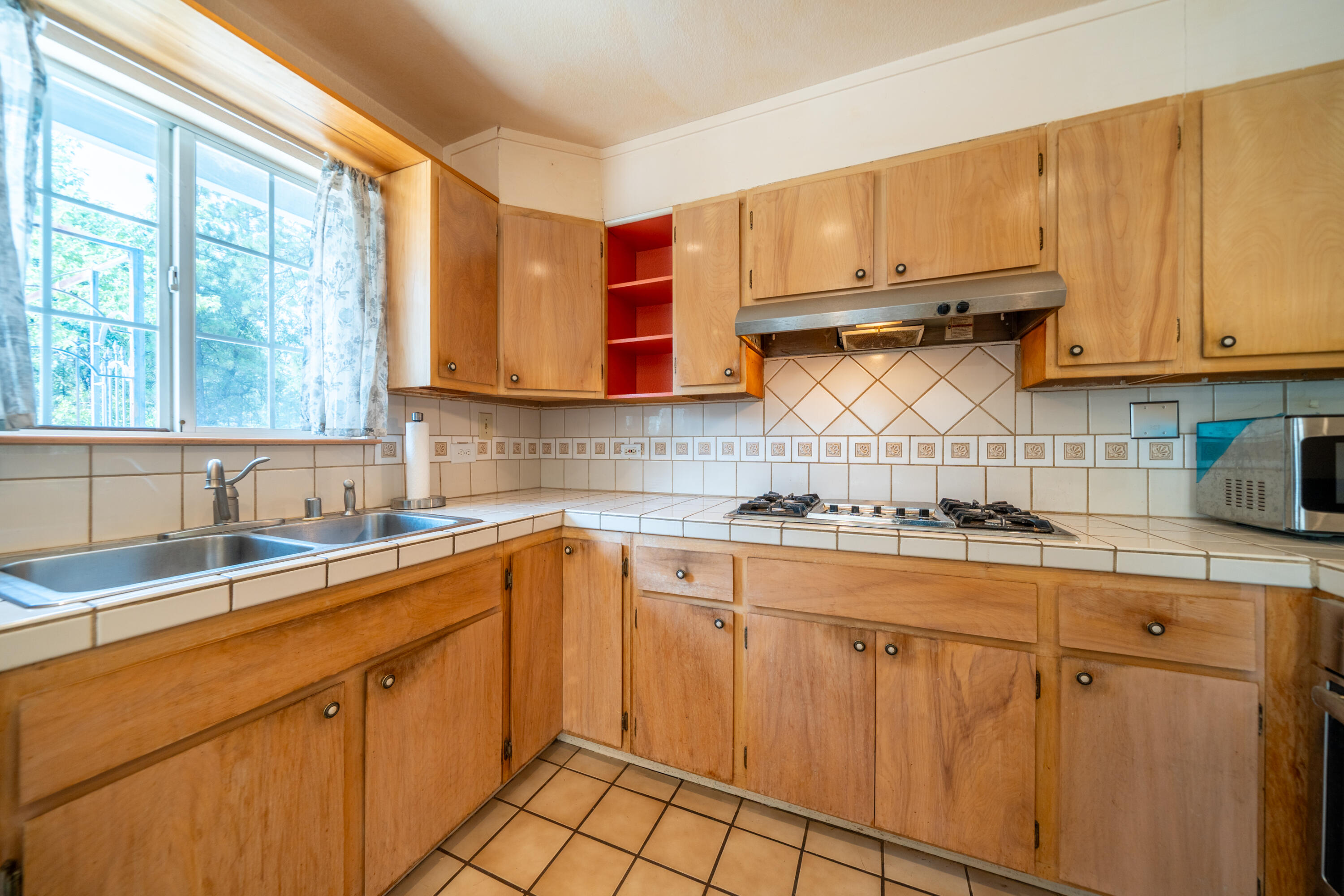 29061 South Cow Creek Road Whitmore, CA 96096 - Photo 9 of 27 a kitchen with stainless steel appliances granite countertop a sink stove and cabinets