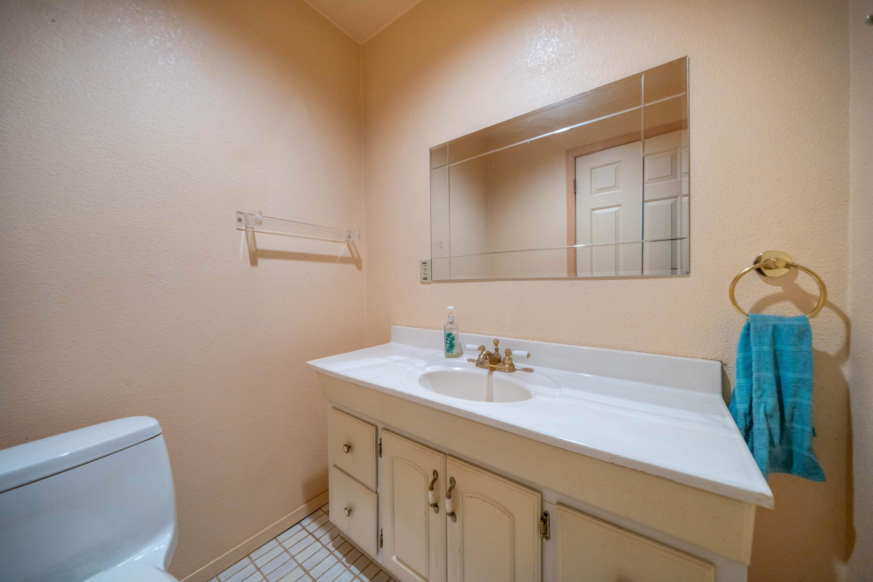 29061 South Cow Creek Road Whitmore, CA 96096 - Photo 10 of 27 a bathroom with a sink toilet and vanity