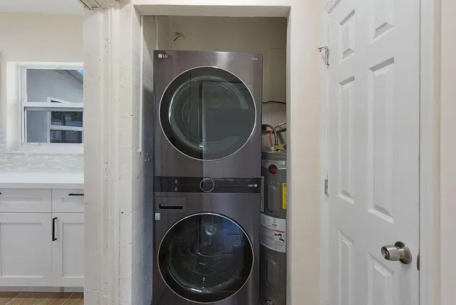 a close view of a utility room with dryer and washer