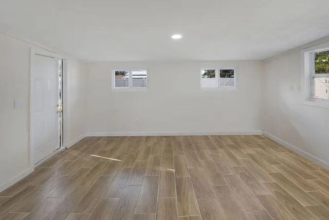 a view of an empty room and a window