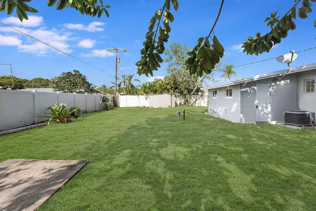 a backyard of a house with lots of green space