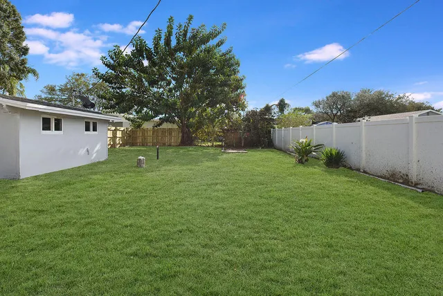 a backyard of a house with lots of green space