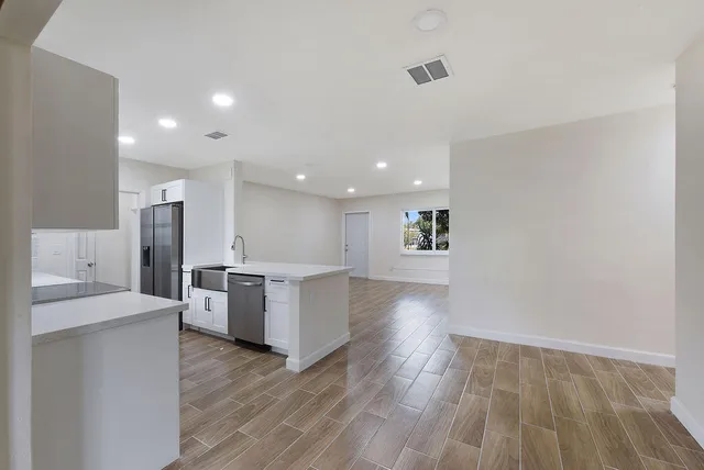 a view of kitchen with wooden floor