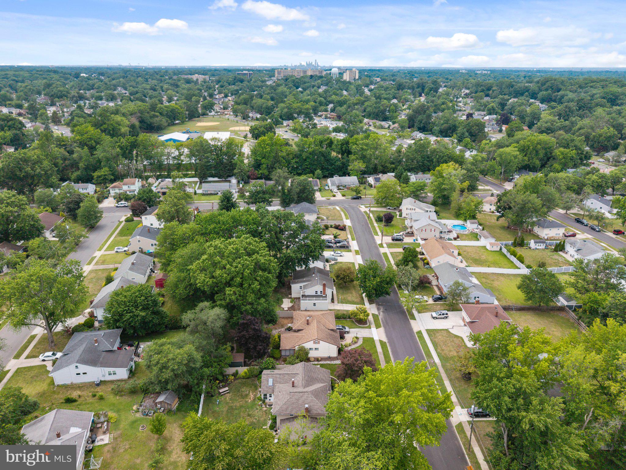 406 Yorkshire Road Cherry Hill, NJ 08034 - Photo 39 of 46 Lush suburban landscape with city skyline.